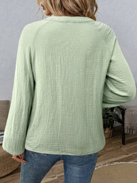 Paisley pattern notched long sleeve blouse by Trendsi, featuring a stylish design with a classic collar and button front.