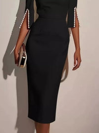 White slim-fit elegant midi dress with beaded slit sleeves by Trendsi, featuring a sleek design and stylish beaded details.