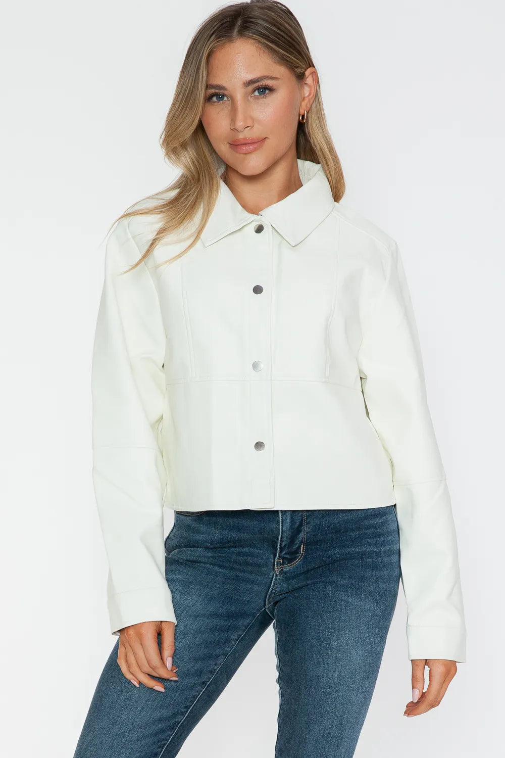 White Snobbish Snap Down Long Sleeve PU Leather Jacket by Trendsi, featuring a sleek design with snap buttons and a fitted silhouette.