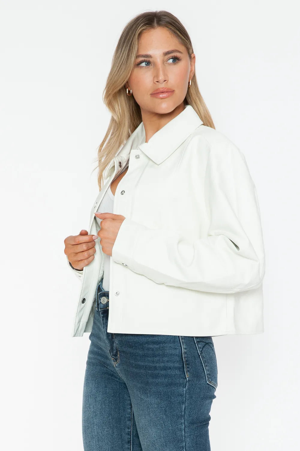White long sleeve PU leather jacket with snap-down collar and stylish design by Trendsi.