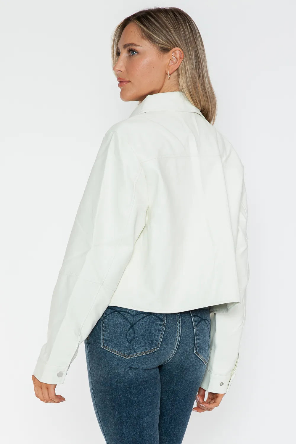 White Snobbish Snap Down Long Sleeve PU Leather Jacket by Trendsi, featuring a stylish snap collar and fitted design.