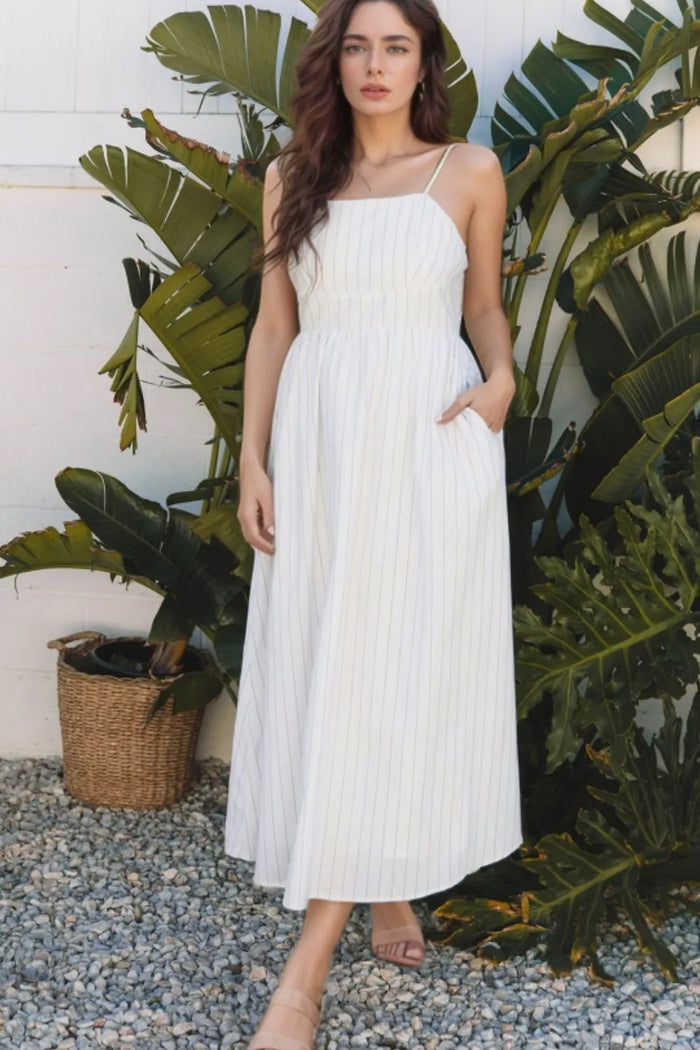 White stripe square neck cami dress with pockets by Trendsi, lightweight fabric, sleeveless design, and relaxed fit.