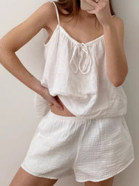 Relaxed fit tie front cami and shorts set by Trendsi, featuring a stylish, casual summer look with lightweight fabric.