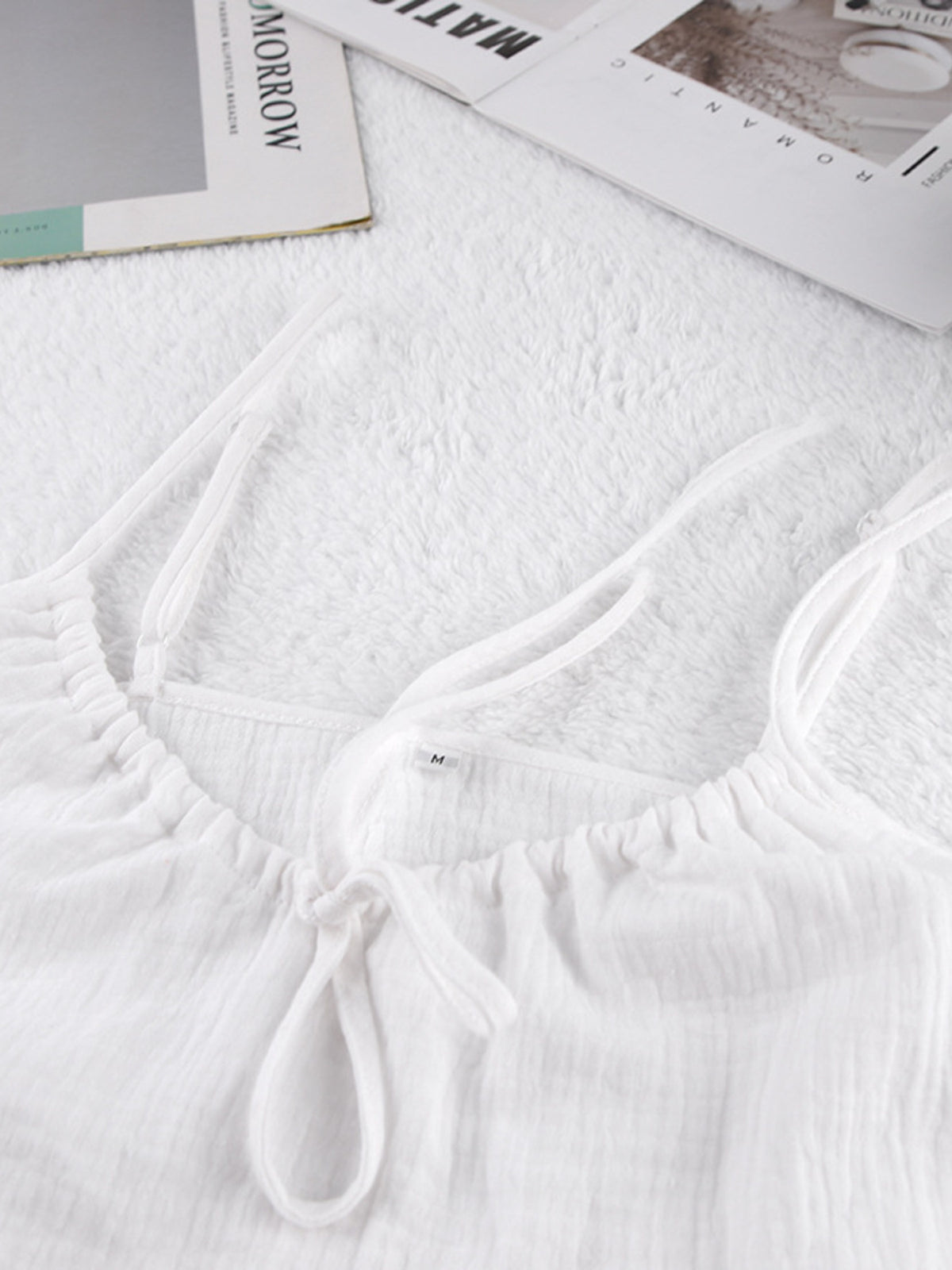 Tie front relaxed fit cami and shorts set by Trendsi, featuring a stylish, comfortable matching top and shorts ensemble.