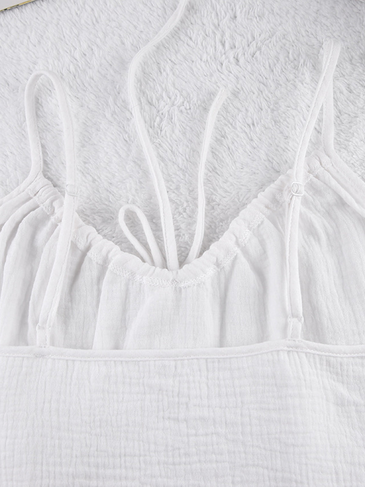 Relaxed fit cami and shorts set with tie front detail, casual trendy loungewear by Trendsi, shown in a stylish, comfortable fabric.