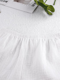 Relaxed fit cami and shorts set with tie front detail, trendy and comfortable, styled for casual wear, by Trendsi.