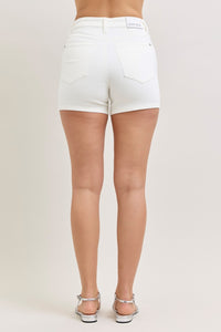 Plus size Judy Blue high-waisted slim shorts from Trendsi, in white, with a fitted design and full coverage.