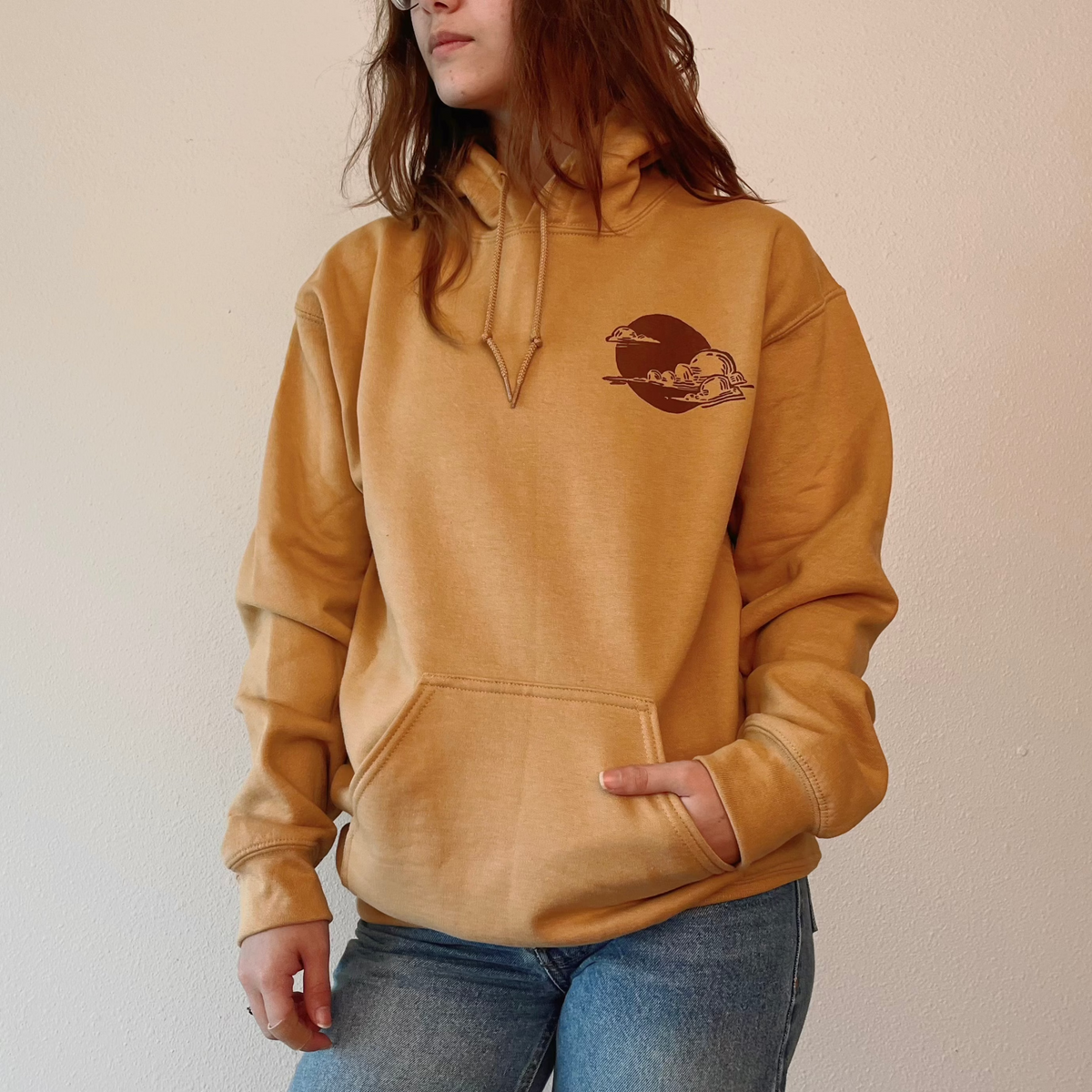 VesperTwine Thundercloud Hoodie in gold, featuring a cozy fit and thundercloud graphic design, displayed flat on a white background.