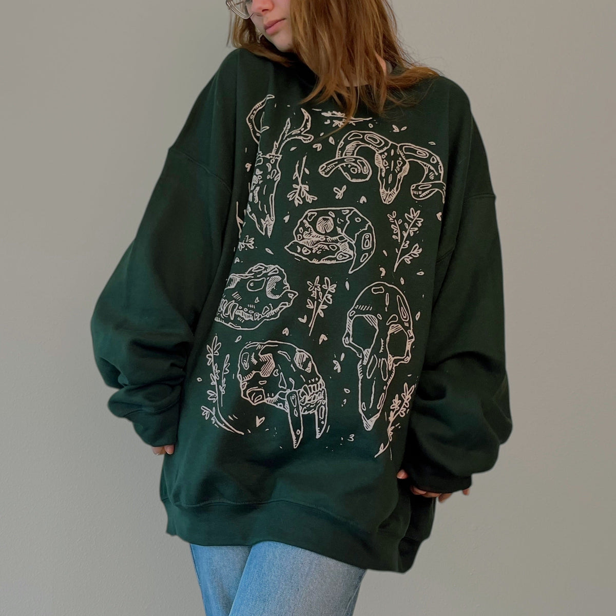 VesperTwine Bones Sweater in Juniper color, featuring a cozy knit design and ribbed cuffs, perfect for casual wear.