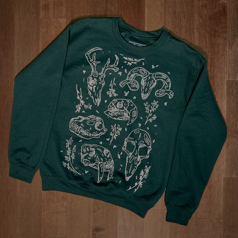 VesperTwine Bones Sweater in Juniper color, showing a cozy knit with bone pattern, long sleeves, and ribbed cuffs.