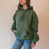 Olive green VesperTwine Home to the Unknown hoodie with front pocket and drawstring hood, casual and comfortable clothing.