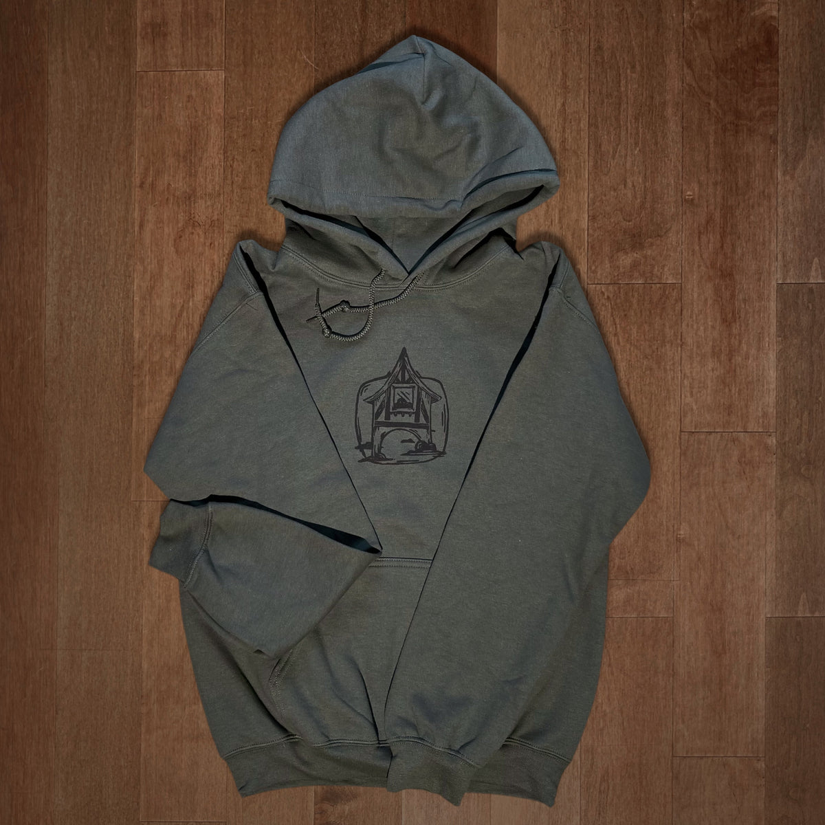 Olive green VesperTwine Home to the Unknown hoodie with front pocket and drawstrings, casual and cozy for everyday wear.