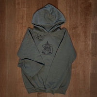 Olive green VesperTwine Home to the Unknown hoodie with front pocket and drawstrings, casual and cozy for everyday wear.