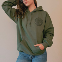 Olive green Monstera Hoodie by VesperTwine featuring a tropical leaf design on soft fabric.