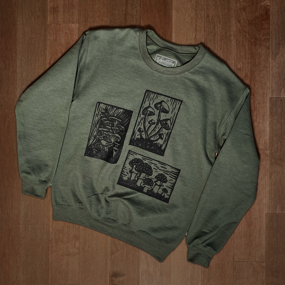 Olive green Mushroom Sweater by VesperTwine featuring a cozy knit design and mushroom pattern on the front.