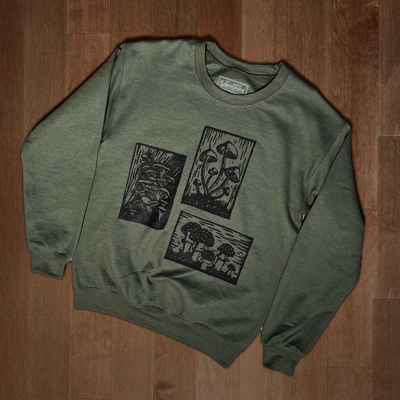 Olive green Mushroom Sweater by VesperTwine featuring a cozy knit design and mushroom pattern on the front.