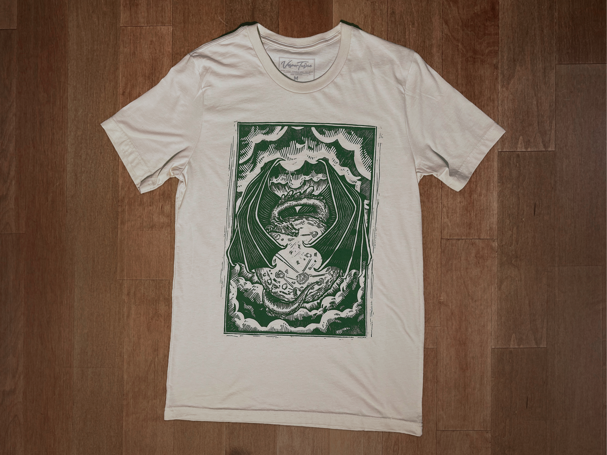 VesperTwine Dragon's Moon T-Shirt showing a mystical dragon and moon design on a moss green shirt, XS size, casual style.