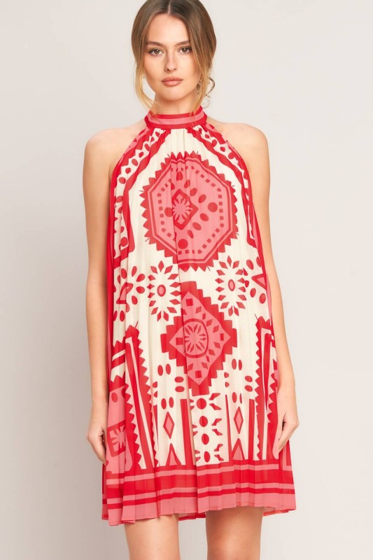 Voglio.us printed halter mini dress with vibrant floral pattern, sleeveless design, and fitted waist on model.