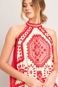 Printed halter mini dress by voglio.us, showcasing a stylish sleeveless dress with a vibrant pattern and halter neckline.