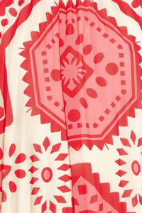 Printed voglio.us halter mini dress with vibrant floral pattern and sleeveless design, perfect for summer occasions.