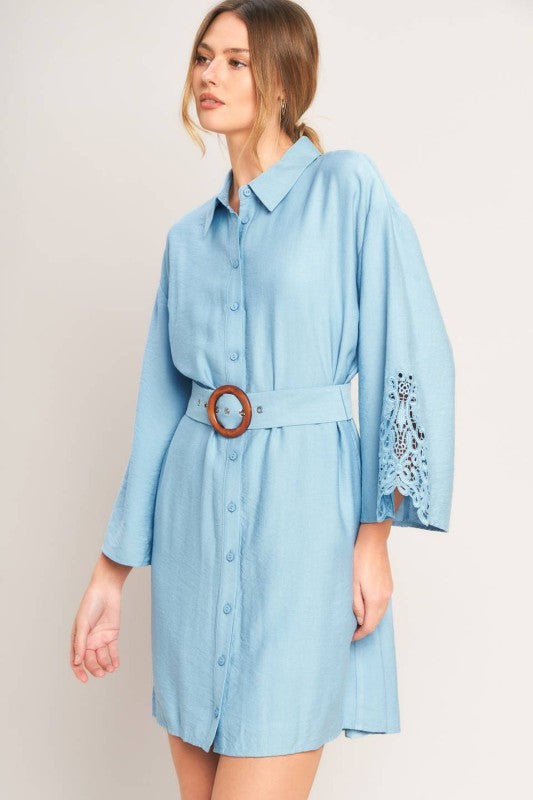 Soft blue belted shirt dress from voglio.us, featuring a relaxed fit, collar, long sleeves, and waist tie for a casual chic look.