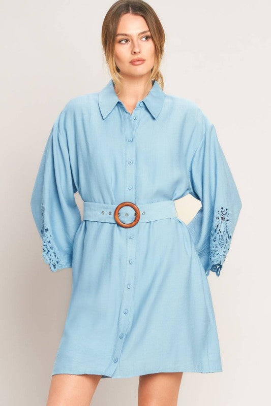 Soft blue belted shirt dress by voglio.us, featuring a classic collar, long sleeves, and a waist belt for a stylish, casual look.