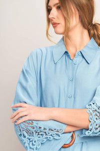 Soft blue belted shirt dress by voglio.us, featuring a collar, long sleeves, and a waist belt for a stylish, casual look.