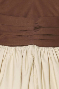 Two-tone twist front midi dress by voglio.us featuring a stylish design and flattering fit, shown on a model.