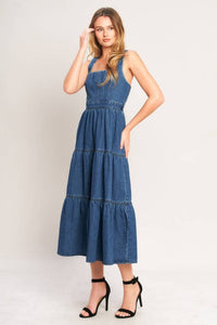 Washed denim midi dress by voglio.us featuring a relaxed fit, button front, and classic denim wash, displayed on a hanger.