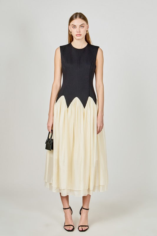 Voglio.us contrast color midi dress featuring a stylish design, sleeveless cut, and vibrant color blocking for a modern look.