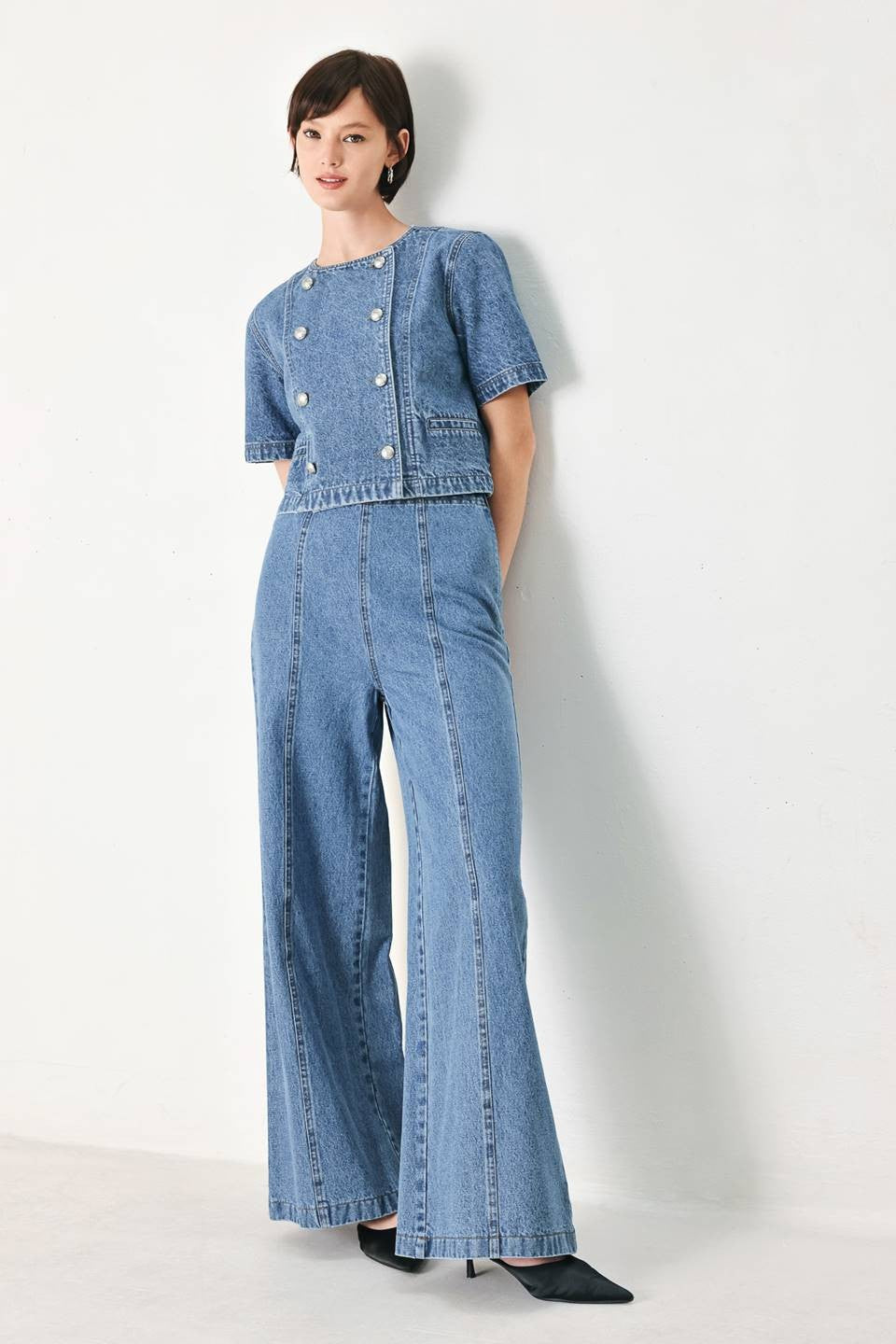 Voglio.us denim jacket with double button detail, casual style, featuring classic blue denim fabric and button accents.