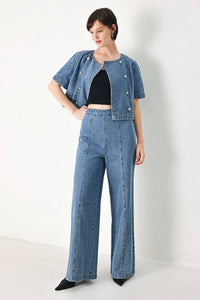 Voglio.us denim jacket featuring double button detail, stylish casual outerwear with classic blue denim fabric and front pockets.