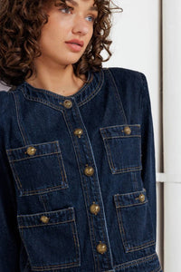 Voglio.us denim utility jacket with gold buttons, featuring a classic design and functional pockets, shown in the image.