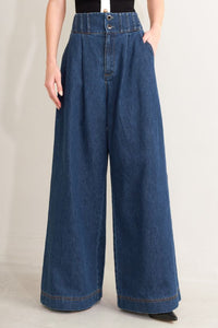 Indigo washed denim wide-leg jeans by voglio.us, showing relaxed fit with detailed stitching and casual style.