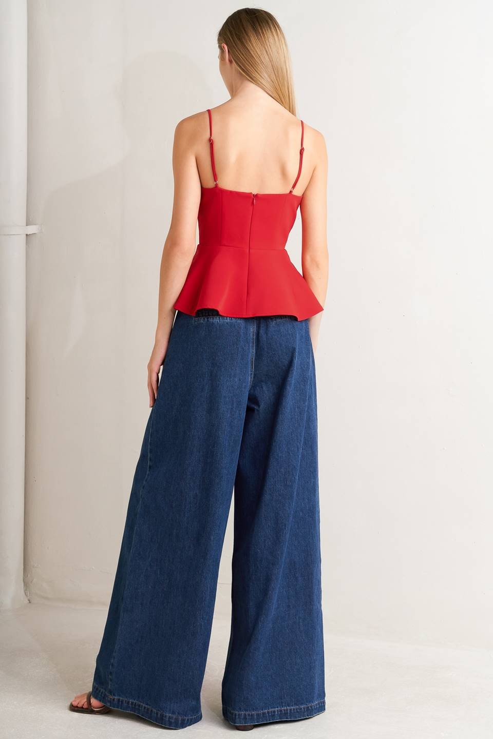 Voglio.us denim jeans with side buckle detail, slim fit, classic blue wash, featuring front and back pockets and belt loops.