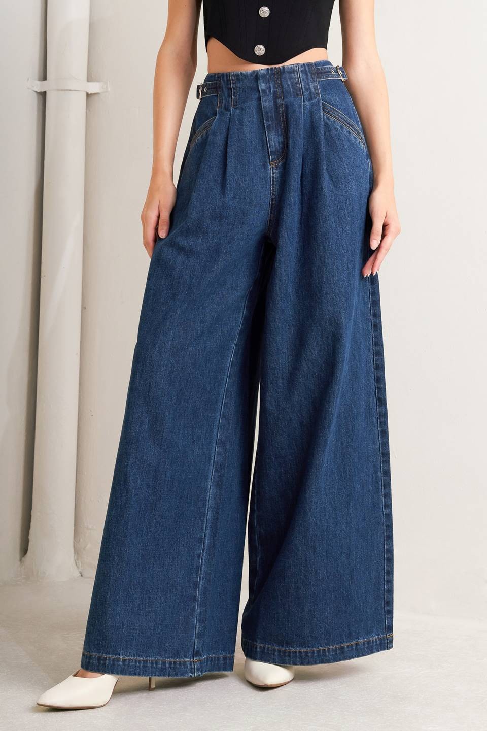 Voglio.us denim jeans with side buckle detail, slim fit, classic blue wash, featuring front pockets and belt loops.