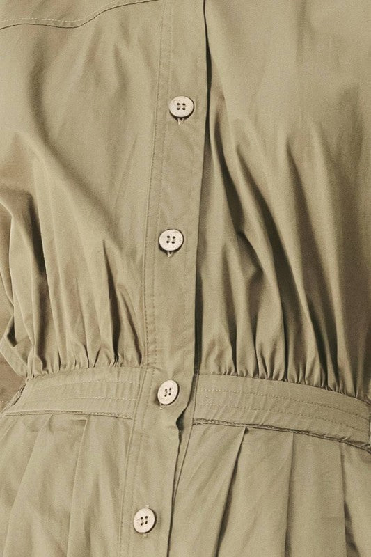 Olive green voglio.us utility jumpsuit with front pockets and adjustable straps, shown on a mannequin.