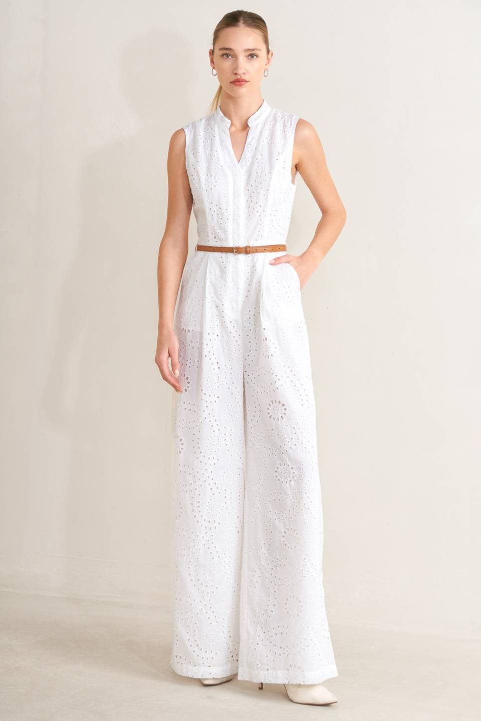 V-Neckline woven eyelet jumpsuit by voglio.us featuring short sleeves, fitted waist, and stylish eyelet fabric details.