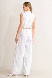V-Neckline woven eyelet jumpsuit by voglio.us featuring short sleeves and a relaxed fit, displayed on a mannequin.