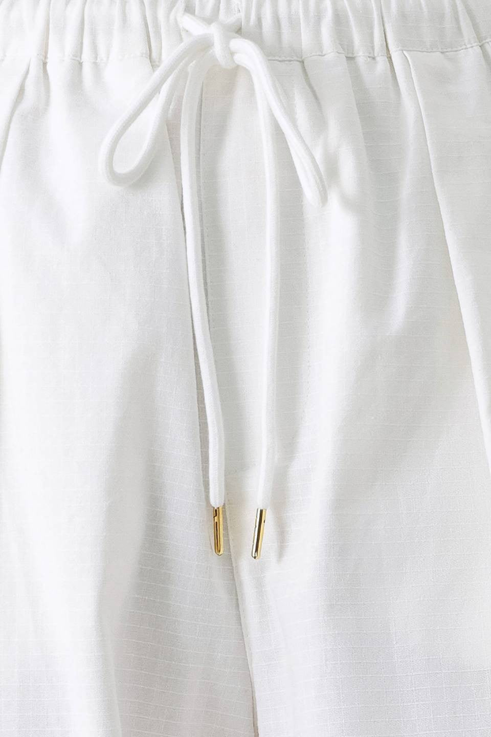 Light beige cotton balloon cargo pants with large side pockets and relaxed fit, by voglio.us.