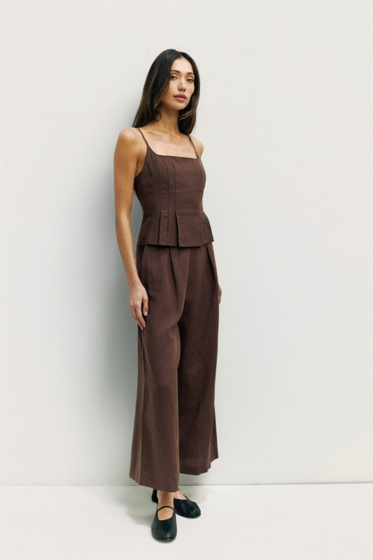 Light beige Jocelyn linen blend wide-leg pants from voglio.us displayed on a hanger with a relaxed fit and flowing silhouette.