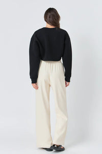 Wide knit pants by voglio.us featuring a soft, textured fabric and a relaxed fit, shown in a neutral color.