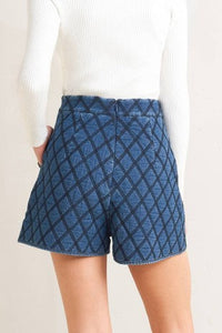 High-waisted quilted denim shorts from voglio.us, featuring a stylish quilted pattern and a classic short length.