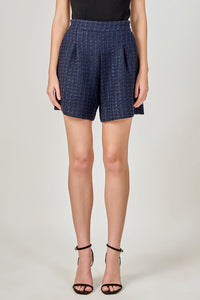 Light brown tweed relaxed long shorts by voglio.us, featuring a comfortable fit and casual style, shown on a model in the image.