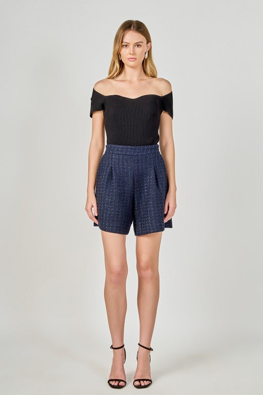 Relaxed fit tweed long shorts by voglio.us, showing the textured fabric and casual style on a model.