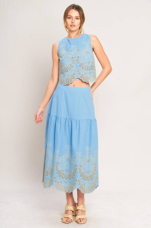 Blue eyelet midi skirt by voglio.us, featuring a stylish design with eyelet details and a comfortable fit.