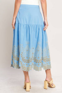 Blue eyelet midi skirt by voglio.us, featuring a stylish length and eyelet fabric design, perfect for casual or semi-formal wear.