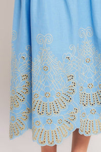 Blue eyelet midi skirt by voglio.us, featuring a stylish, flowy design with eyelet detailing and a comfortable waist.