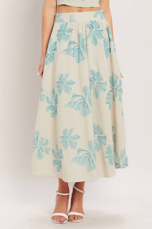 Floral linen blend skirt by voglio.us with a flowy design, featuring colorful floral patterns and lightweight fabric.