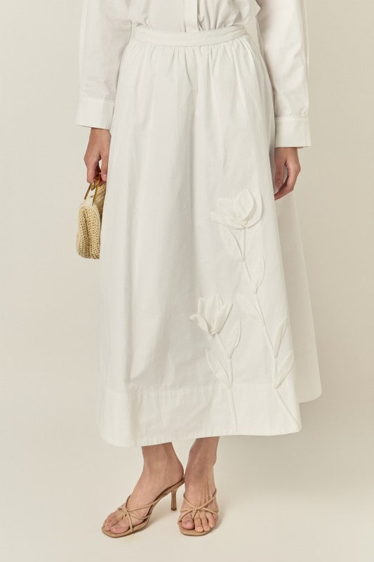 Appliqued accent midi skirt from voglio.us featuring a stylish design and mid-length silhouette, shown in the product image.